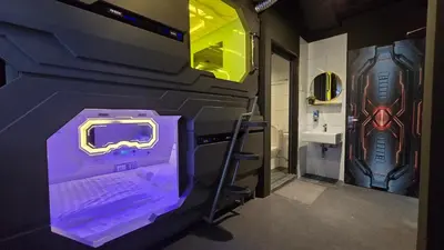 a room with a bed in a room with a superhero room at Space Hotel KL Sentral in Kuala Lumpur