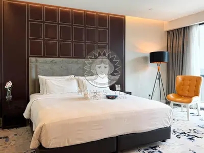 a bedroom with a large bed with a large headboard at HOME STYLE at Platinum Suites 2 KLCC Twin Towers in Kuala Lumpur
