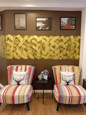 two chairs and a table in a room at Fahrenheit 88 Suites Bukit Bintang C 3R in Kuala Lumpur