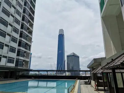 a swimming pool in the middle of some buildings at Fahrenheit 88 Suites Bukit Bintang C 3R in Kuala Lumpur