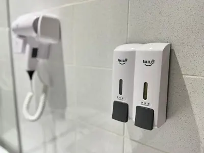 two wii controllers are hanging on a wall at Sky Hotel Chow Kit PWTC in Kuala Lumpur