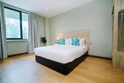 a bedroom with a large white bed in a room at Kingston Hotel 8 - Kuala Lumpur Bukit Bintang in Kuala Lumpur