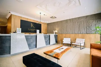 a living room with a couch and a table at Kingston Hotel 8 - Kuala Lumpur Bukit Bintang in Kuala Lumpur