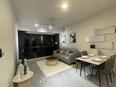 a living room with a couch and a table at Agile Residence TRX Bukit Bintang by Cal in Kuala Lumpur