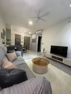 a living room with a couch and a tv at Agile Residence TRX Bukit Bintang by Cal in Kuala Lumpur