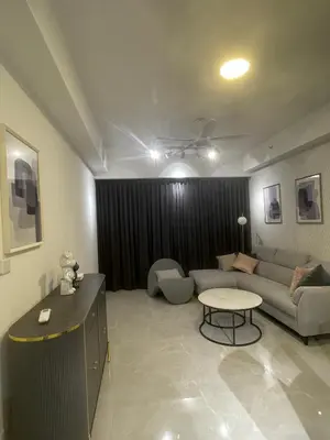 a living room with a couch and a table at Agile Residence TRX Bukit Bintang by Cal in Kuala Lumpur