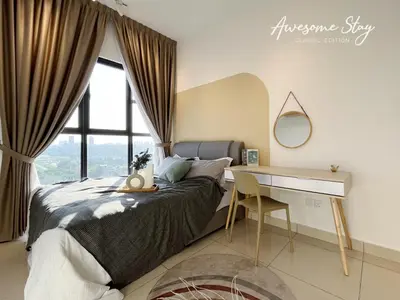 a bedroom with a bed with a desk and a window at Residensi Trion in Kuala Lumpur