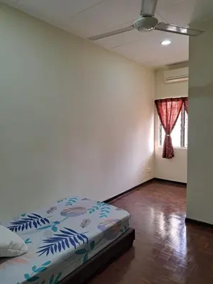 a bedroom with a bed and a room with a window at Double-story House in Kuala Lumpur in Ampang