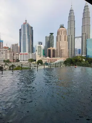 a view of a city from a boat in the water at Badang Homestay KLCC in Kuala Lumpur
