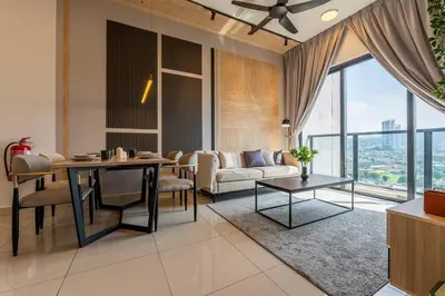 a living room with a couch and a table at Modern Design 2BR Astoria in Kuala Lumpur
