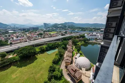 an aerial view of a city with a bridge over a river at Modern Design 2BR Astoria in Kuala Lumpur