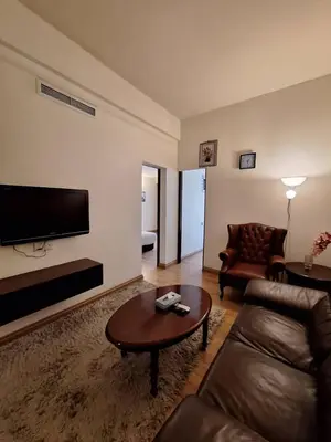 a living room with a couch and a coffee table at Best Apartment Suite At Times Square KL in Kuala Lumpur