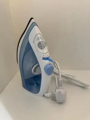 a blue and white electric hair dryer with a cord at TheOoak 1BRoom cozyhome with balcony in Kuala Lumpur