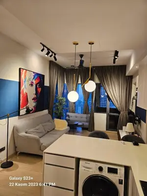 a living room with a couch and a table at Star Residence T1, 2br Unit Floor 36 in Kuala Lumpur