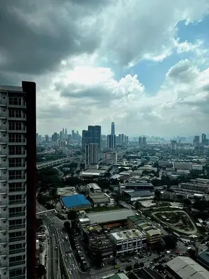 an aerial view of a city with buildings and cars at Ayazuki Sky Suite KLCC View 2BR Free Parking Netflix Swimming Pool in Kuala Lumpur