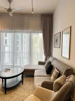 a living room with a couch and a table at Atmoods - The Mews KLCC in Kuala Lumpur