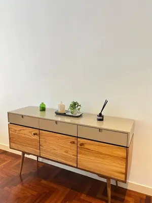 a wooden dresser with a counter top in a room at Atmoods - The Mews KLCC in Kuala Lumpur