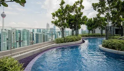 a swimming pool on the roof of a building at Mid Night Realm Kuala Lumpur in Kuala Lumpur