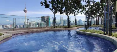 a large swimming pool with a view of the city at Mid Night Realm Kuala Lumpur in Kuala Lumpur