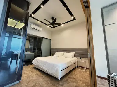 a bedroom with a bed and a ceiling fan at Expressionz KLCC By Sky Homez in Kuala Lumpur