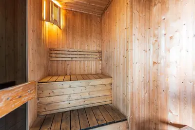 a wooden sauna with wooden floors and walls at Dorsett Residence Kuala Lumpur 8 pax in Kuala Lumpur