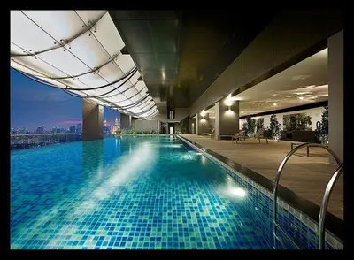 a large swimming pool in a building with a view at Mcity Residence way to KLCC in Kuala Lumpur