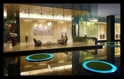 a large room with a pool with chairs at Mcity Residence way to KLCC in Kuala Lumpur