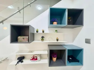 a staircase with blue and white shelves at Mcity Residence way to KLCC in Kuala Lumpur