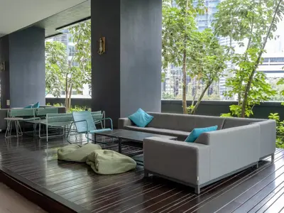 a living room with a couch and a table at Star KLCC Twin Tower Suite 2-3pax by DingDing in Kuala Lumpur