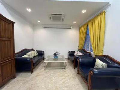a living room with couches and a coffee table at Titiwangsa Premium Villa KL by uBook in Kuala Lumpur