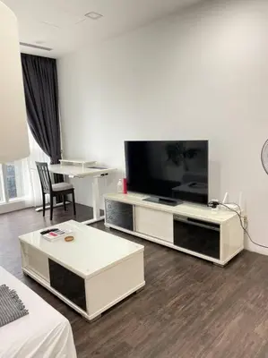 a living room with a flat screen tv on a entertainment center at Binjai 8 Soho Premium Near KLCC & LRT KLCC in Kuala Lumpur