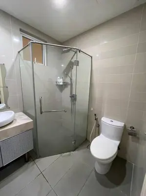 a bathroom with a shower and a toilet and a sink at Binjai 8 Soho Premium Near KLCC & LRT KLCC in Kuala Lumpur