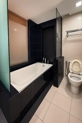 a bathroom with a bath tub and a toilet at KL Sentral Dua Sentral Cozy Homestay Apartments by Hollywood Homes #FreeCarPark in Kuala Lumpur