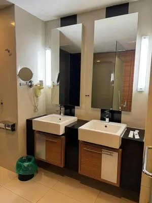 a bathroom with two sinks and a large mirror at KL Sentral Dua Sentral Cozy Homestay Apartments by Hollywood Homes #FreeCarPark in Kuala Lumpur