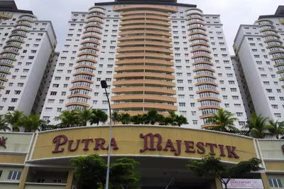 a large building with a sign in front of it at Monkey Mansion Signature in Kuala Lumpur
