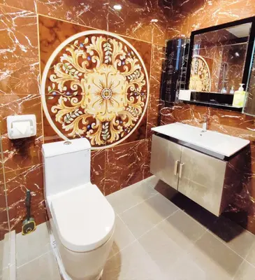 a bathroom with a toilet and a sink and a mirror at Bukit Bintang Pavilion KLCC Wisma Cosway in Kuala Lumpur