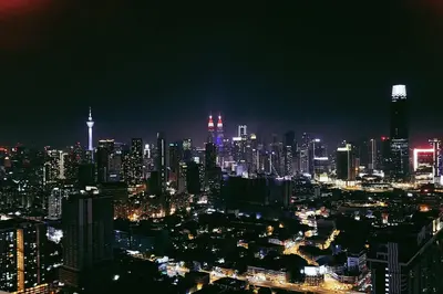 a nighttime view of a city at night at KLCC sky view 1BR luxury suites with Balcony Trion A5507 KL in Kuala Lumpur