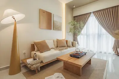 a living room with a couch and a coffee table at NaiBnB in Agile Bukit Bintang - 5 mins walk to TRX in Kuala Lumpur