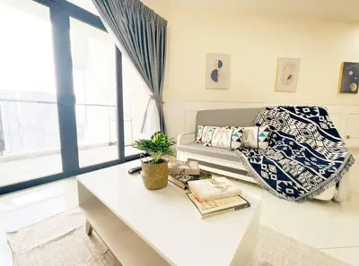a living room with a couch and a table at Cheras KL Premium 3B2B by Luvit Stay in Kuala Lumpur