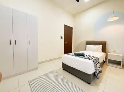 a white bedroom with a bed and a cabinet at Cheras KL Premium 3B2B by Luvit Stay in Kuala Lumpur