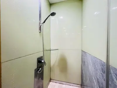 a shower with a glass door in a bathroom at Soho Suites KLCC by DeUrban in Kuala Lumpur