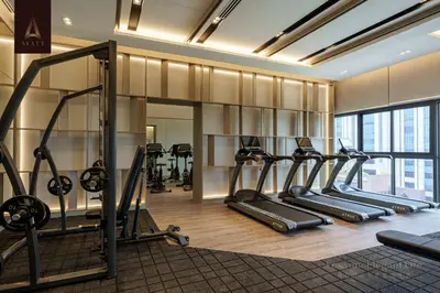 a gym with a row of treadmills and ellipticals at Ayatt Bukit Bintang in Kuala Lumpur
