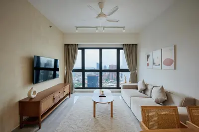 a living room with a couch and a table at Ayatt Bukit Bintang in Kuala Lumpur