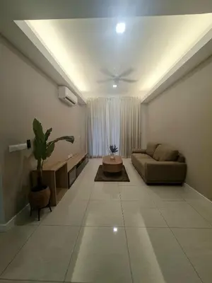 a living room with a couch and a table at Muji Themed Apartment by Zen Sojourn - Opposite KL SENTRAL in Kuala Lumpur