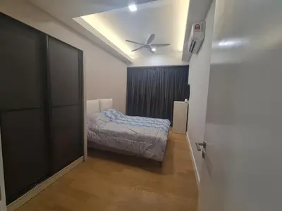 a bedroom with a bed and a ceiling fan at Muji Themed Apartment by Zen Sojourn - Opposite KL SENTRAL in Kuala Lumpur