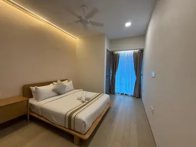 a bedroom with a bed and a window at Eaton Residence Klcc By Apple in Kuala Lumpur