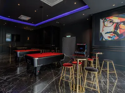 a room with a piano and stools and a large screen at Star KLCC Elegant 2-3pax by DingDing in Kuala Lumpur
