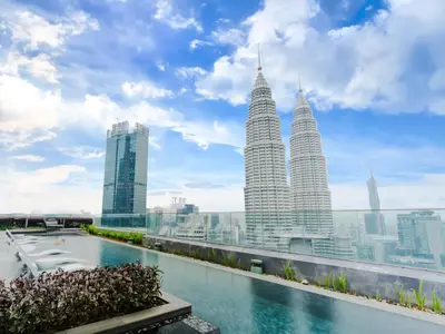 a view of the petronas twin towers from the rooftop of a building at Star KLCC Elegant 2-3pax by DingDing in Kuala Lumpur