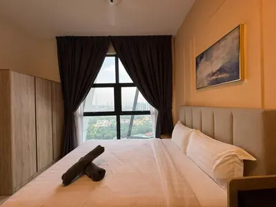 a bedroom with a large bed with a large window at Arte mont kiara by Sweet home in Kuala Lumpur