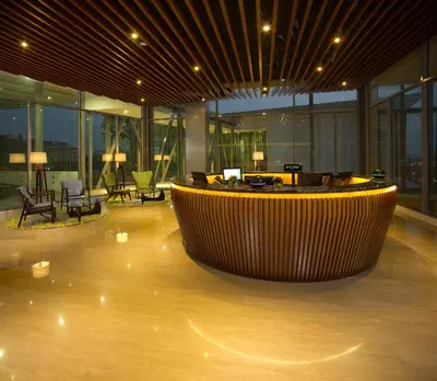 a large lobby with a large tub in the middle of a building at The Signature Hotel & Serviced Suites Hartamas Kuala Lumpur in Kuala Lumpur